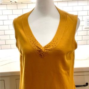 Goldenrod colored Requirements brand sleeveless sweater w/ bead embellishments.